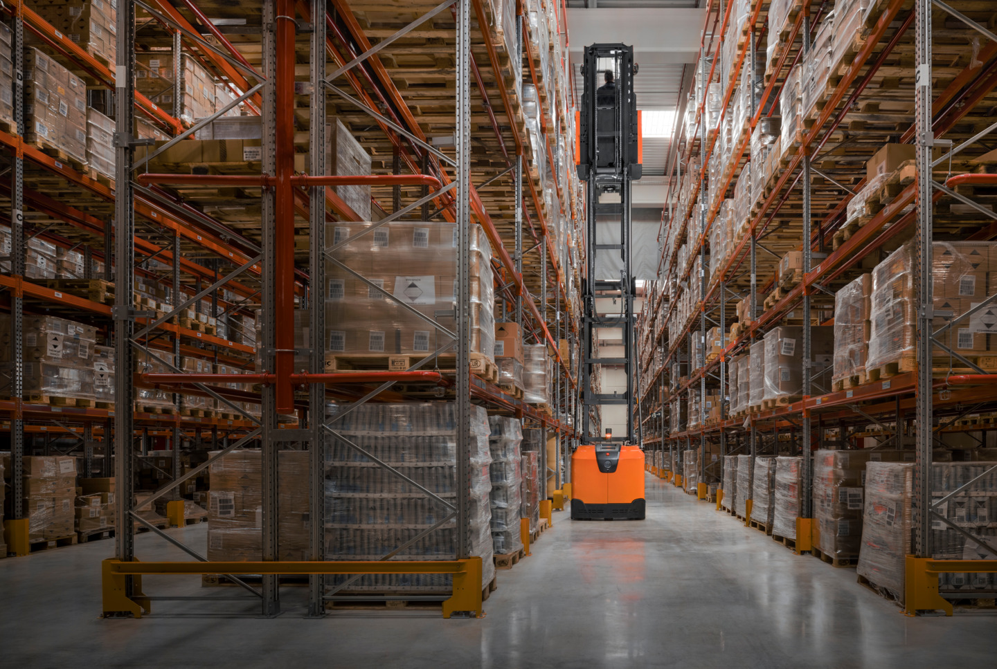 Toyota BT Optio high-level order picker in narrow aisle